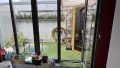 Schlafzimmer OG mit Blick auf Patio und Sauna