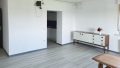Wohnzimmer mit Zugang zur Küche